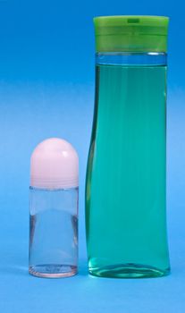 Plastic clean shampoo bottle isolated on a blue background