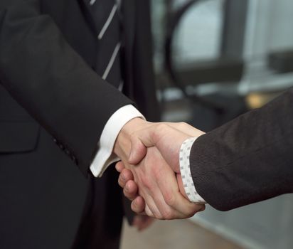 Close-up of a handshake with selective focus