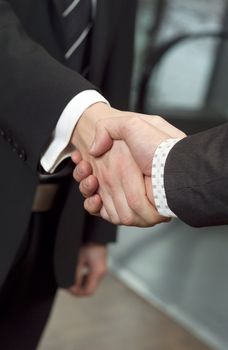 Close-up of a handshake with selective focus