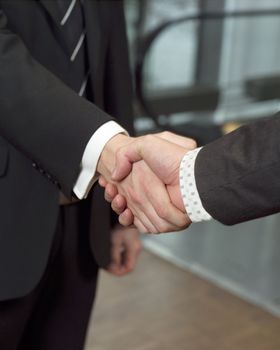 Close-up of a handshake with selective focus