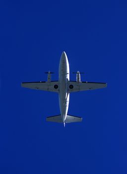 Airplane from low angle view on blue sky