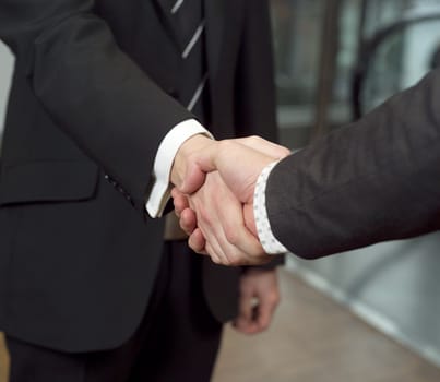 Close-up of a handshake with selective focus