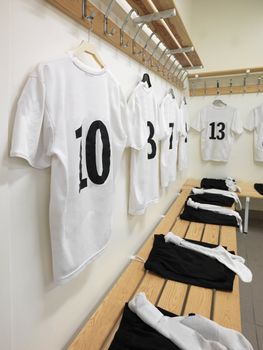 Soccer teams dressing room with numbered shirts