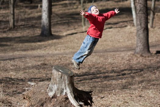 Fun jump - little sport child high jumping up long