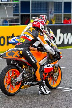 JEREZ DE LA FRONTERA, SPAIN - NOV 20: 125cc motorcyclist Alex Rins waiting on the starting gates in the CEV Championship race on November 20, 2011 in Jerez de la Frontera, Spain.
