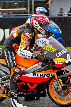 JEREZ DE LA FRONTERA, SPAIN - NOV 20: 125cc motorcyclist Alex Rins waiting on the starting gates in the CEV Championship race on November 20, 2011 in Jerez de la Frontera, Spain.