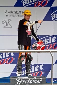 JEREZ DE LA FRONTERA, SPAIN - NOV 20: 125cc motorcyclist Alex Rins on the podium like winner of the 125cc CEV Championship on November 20, 2011, in Jerez de la Frontera, Spain