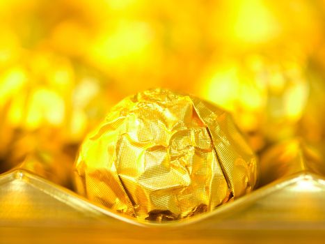 close up of candy in gold wrappers