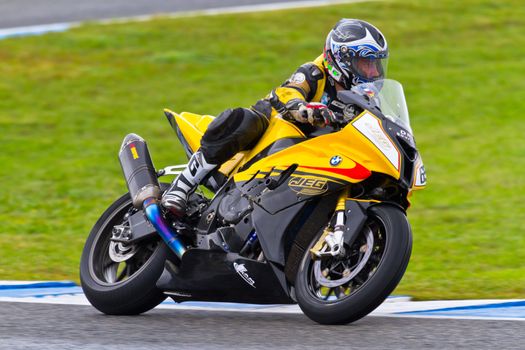 JEREZ DE LA FRONTERA, SPAIN - NOV 20: Stock Extreme motorcyclist Juan Eric Gomez takes a curve in the CEV Championship race on November 20, 2011 in Jerez de la Frontera, Spain