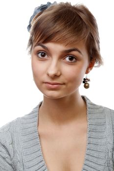 Portrait of the young girl in flower in hair on white background
