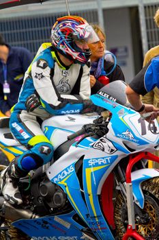 JEREZ DE LA FRONTERA, SPAIN - NOV 20: Stock Extreme motorcyclist Alexandre Praud waiting on the starting gates in the CEV Championship race on November 20, 2011 in Jerez de la Frontera, Spain