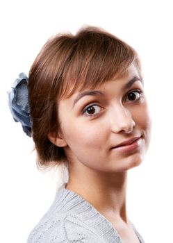 Portrait of the young girl in flower in hair on white background