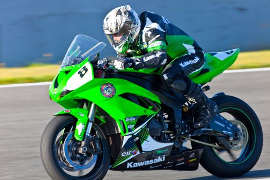 JEREZ DE LA FRONTERA, SPAIN - APR 16: Kawasaki Ninja Cup motorcyclist Adria Araujo races in the CEV Championship race on April 16, 2011 in Jerez de la Frontera, Spain.