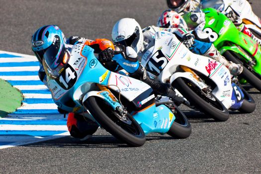 JEREZ DE LA FRONTERA, SPAIN - APR 16: 125cc motorcyclists Kumar(14), Fenati(15) and Guevara(58)takes a curve in the CEV Championship race on April 16, 2011 in Jerez de la Frontera, Spain.