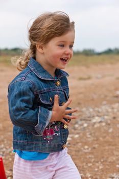 people series: little girl on the beach play with toy