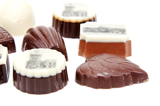 Chocolate sweetmeats with type of the Prague on white background