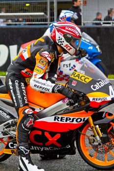 JEREZ DE LA FRONTERA, SPAIN - NOV 20: 125cc motorcyclist Alex Rins waiting on the starting gates in the CEV Championship race on November 20, 2011 in Jerez de la Frontera, Spain.