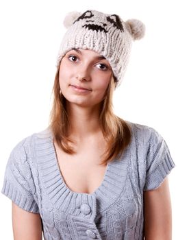 Portrait of the young girl in hat on white background