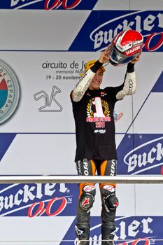 JEREZ DE LA FRONTERA, SPAIN - NOV 20: 125cc motorcyclist Alex Rins on the podium like winner of the 125cc CEV Championship on November 20, 2011, in Jerez de la Frontera, Spain