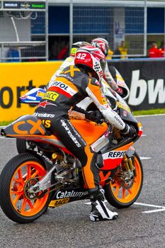 JEREZ DE LA FRONTERA, SPAIN - NOV 20: 125cc motorcyclist Alex Rins waiting on the starting gates in the CEV Championship race on November 20, 2011 in Jerez de la Frontera, Spain.