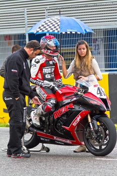 JEREZ DE LA FRONTERA, SPAIN - NOV 20: Stock Extreme motorcyclist Raul Martinez waiting on the starting gates in the CEV Championship race on November 20, 2011 in Jerez de la Frontera, Spain