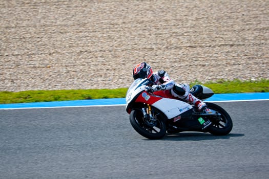 JEREZ DE LA FRONTERA, SPAIN - MAR 5: 125cc motorcyclist Louis Rossi races on the official training of the world championship of MotoGP on March 5, 2011 in Jerez de la Frontera, Spain