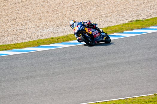 JEREZ DE LA FRONTERA, SPAIN - MAR 5:125cc pilot Jonas Folger takes a curve on the official training of the world championship of MotoGP on Mar 5, 2011, in Jerez de la Frontera, Spain
