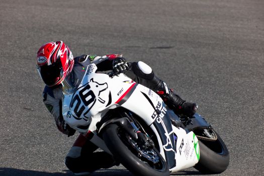 JEREZ DE LA FRONTERA, SPAIN - APR 16: Stock Extreme motorcyclist Adrian Gandara Gutierrez takes a curve in the CEV Championship race on April 16, 2011 in Jerez de la Frontera, Spain
