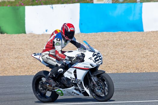 JEREZ DE LA FRONTERA, SPAIN - APR 16: Stock Extreme motorcyclist Adrian Gandara Gutierrez takes a curve in the CEV Championship race on April 16, 2011 in Jerez de la Frontera, Spain