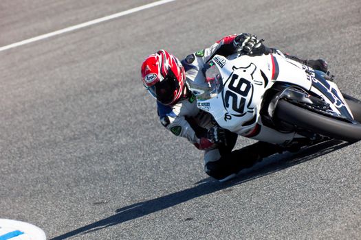JEREZ DE LA FRONTERA, SPAIN - APR 16: Stock Extreme motorcyclist Adrian Gandara Gutierrez takes a curve in the CEV Championship race on April 16, 2011 in Jerez de la Frontera, Spain