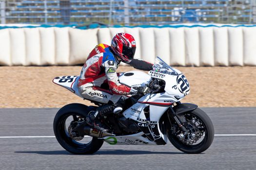 JEREZ DE LA FRONTERA, SPAIN - APR 16: Stock Extreme motorcyclist Adrian Gandara Gutierrez takes a curve in the CEV Championship race on April 16, 2011 in Jerez de la Frontera, Spain