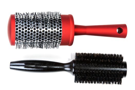 Two red massages comb on white background