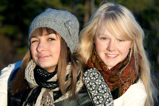 Portrait two young beautiful girls in wood