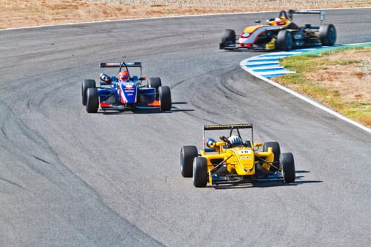 JEREZ DE LA FRONTERA, SPAIN - OCT 16: Alex Fontana (11) followed by Sam Dejonghe (58) and Matteo Beretta (7)  races on European F3 championship on October 16 , 2011, in Jerez de la Frontera , Spain