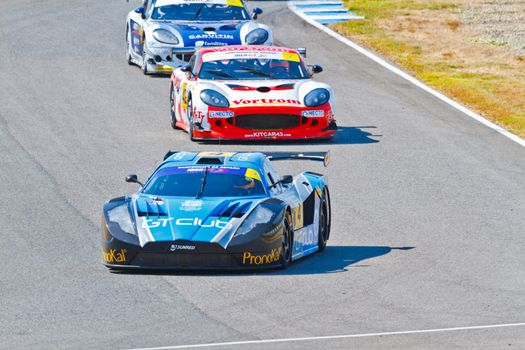 JEREZ DE LA FRONTERA, SPAIN - OCT 16: Ferran Monje(4) followed by Francesc Gutierrez(42) and Pedro Lopes(44) races on Iber GT championship on October 16 , 2011, in Jerez de la Frontera , Spain