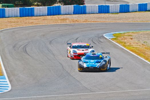 JEREZ DE LA FRONTERA, SPAIN - OCT 16: Ferran Monje(4) followed by Francesc Gutierrez(42)races on Iber GT championship on October 16 , 2011, in Jerez de la Frontera , Spain
