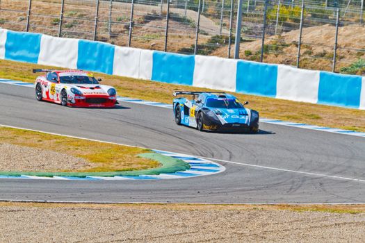 JEREZ DE LA FRONTERA, SPAIN - OCT 16: Ferran Monje(4) followed by Francesc Gutierrez(42)races on Iber GT championship on October 16 , 2011, in Jerez de la Frontera , Spain