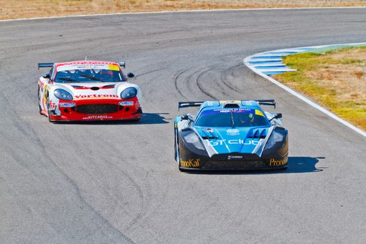 JEREZ DE LA FRONTERA, SPAIN - OCT 16: Ferran Monje(4) followed by Francesc Gutierrez(42)races on Iber GT championship on October 16 , 2011, in Jerez de la Frontera , Spain