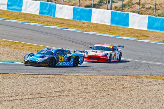JEREZ DE LA FRONTERA, SPAIN - OCT 16: Ferran Monje(4) followed by Francesc Gutierrez(42)races on Iber GT championship on October 16 , 2011, in Jerez de la Frontera , Spain