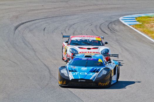 JEREZ DE LA FRONTERA, SPAIN - OCT 16: Ferran Monje(4) followed by Francesc Gutierrez(42)races on Iber GT championship on October 16 , 2011, in Jerez de la Frontera , Spain