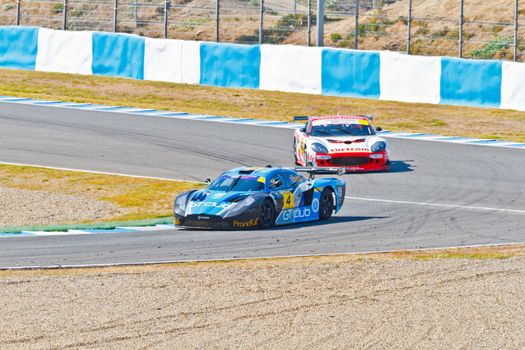 JEREZ DE LA FRONTERA, SPAIN - OCT 16: Ferran Monje(4) followed by Francesc Gutierrez(42)races on Iber GT championship on October 16 , 2011, in Jerez de la Frontera , Spain