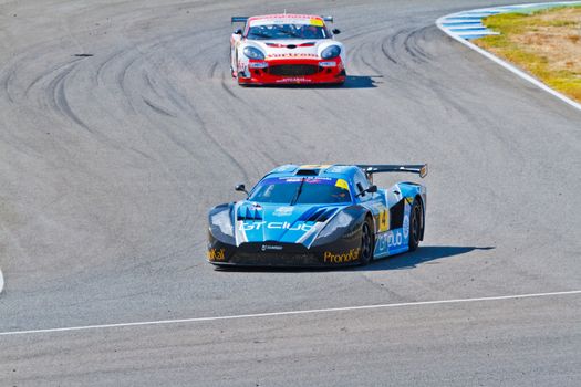JEREZ DE LA FRONTERA, SPAIN - OCT 16: Ferran Monje(4) followed by Francesc Gutierrez(42)races on Iber GT championship on October 16 , 2011, in Jerez de la Frontera , Spain