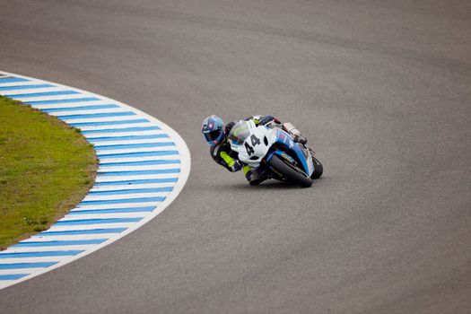 JEREZ DE LA FRONTERA, SPAIN - NOV 20: Stock Extreme motorcyclist Arturo Tizon takes a curve in the CEV championship on Nov 20, 2010, in Jerez de la Frontera, Spain