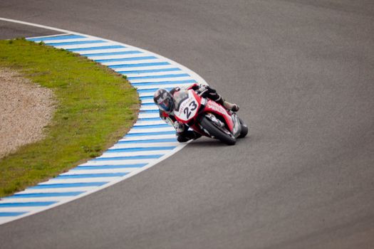 JEREZ DE LA FRONTERA, SPAIN - NOV 20: Stock Extreme motorcyclist Adrian Bonastre takes a curve in the CEV championship on Nov 20, 2010, in Jerez de la Frontera, Spain