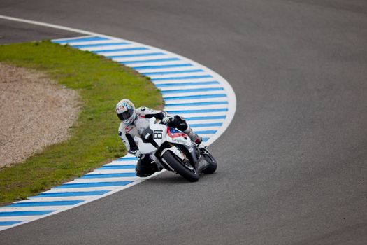 JEREZ DE LA FRONTERA, SPAIN - NOV 20: Stock Extreme motorcyclist Eduardo Salvador takes a curve in the CEV championship on Nov 20, 2010, in Jerez de la Frontera, Spain