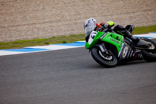 JEREZ DE LA FRONTERA, SPAIN - NOV 20: Stock Extreme motorcyclist Oscar Ibañez takes a curve in the CEV championship on Nov 20, 2010, in Jerez de la Frontera, Spain