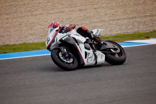 JEREZ DE LA FRONTERA, SPAIN - NOV 20: Stock Extreme motorcyclist Adrian Gandara takes a curve in the CEV championship on Nov 20, 2010, in Jerez de la Frontera, Spain