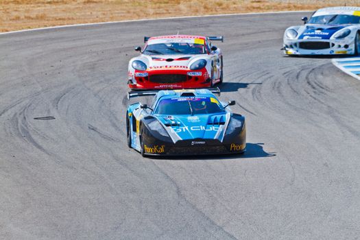 JEREZ DE LA FRONTERA, SPAIN - OCT 16: Ferran Monje(4) followed by Francesc Gutierrez(42) and Pedro Lopes(44) races on Iber GT championship on October 16 , 2011, in Jerez de la Frontera , Spain