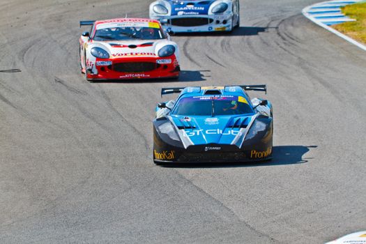 JEREZ DE LA FRONTERA, SPAIN - OCT 16: Ferran Monje(4) followed by Francesc Gutierrez(42) and Pedro Lopes(44) races on Iber GT championship on October 16 , 2011, in Jerez de la Frontera , Spain