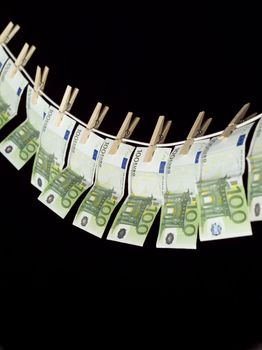 Laundering money towards black background